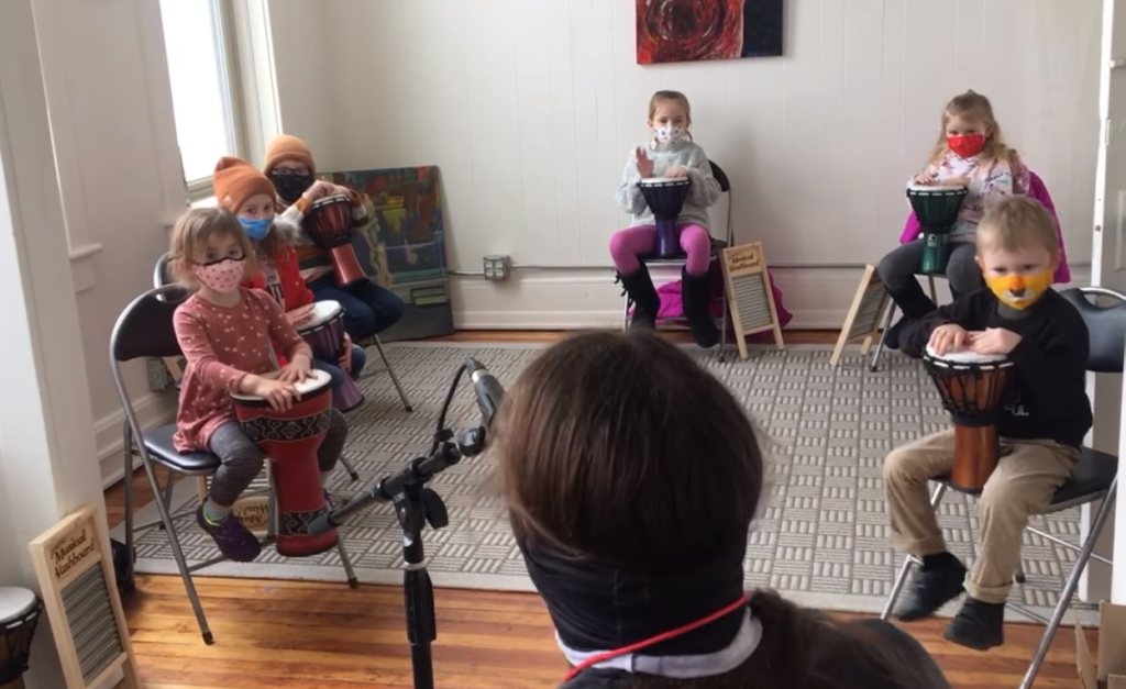 Local musician Grant Emeigh leads students in an exercise during the Rhythm Kids class at Beat City Music.